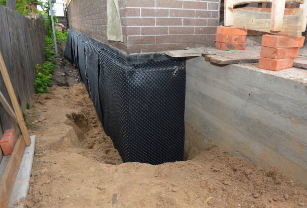 SJ Waterproofing Pros technician performing targeted Interior Drainage System assessment in Medina, OH